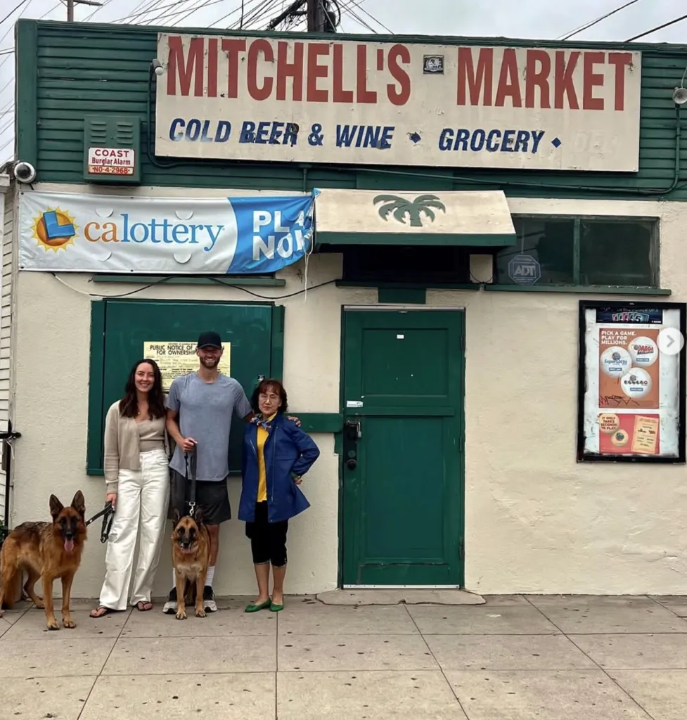 People and dogs in front of Mitchell's Market.