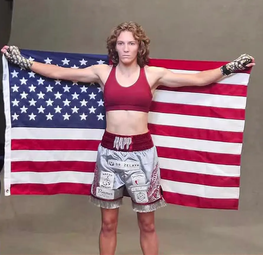 Boxer Hannah Rapp holding an American flag.