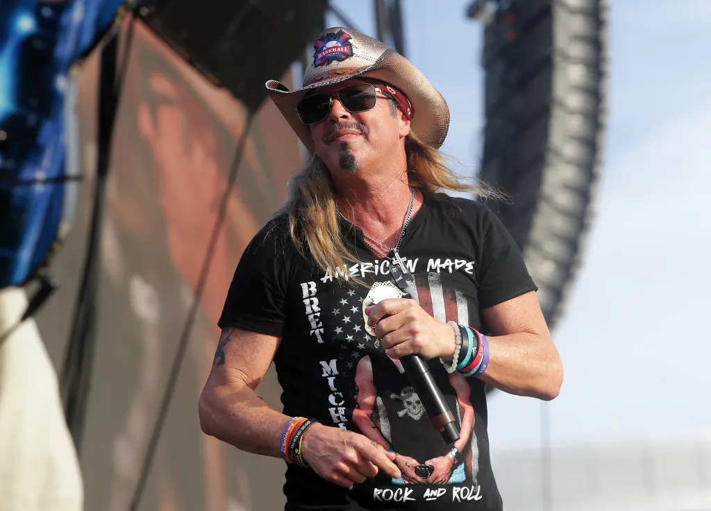 Bret Michaels, wearing a cowboy hat and sunglasses, performs at the 2026 Extra Innings Festival.