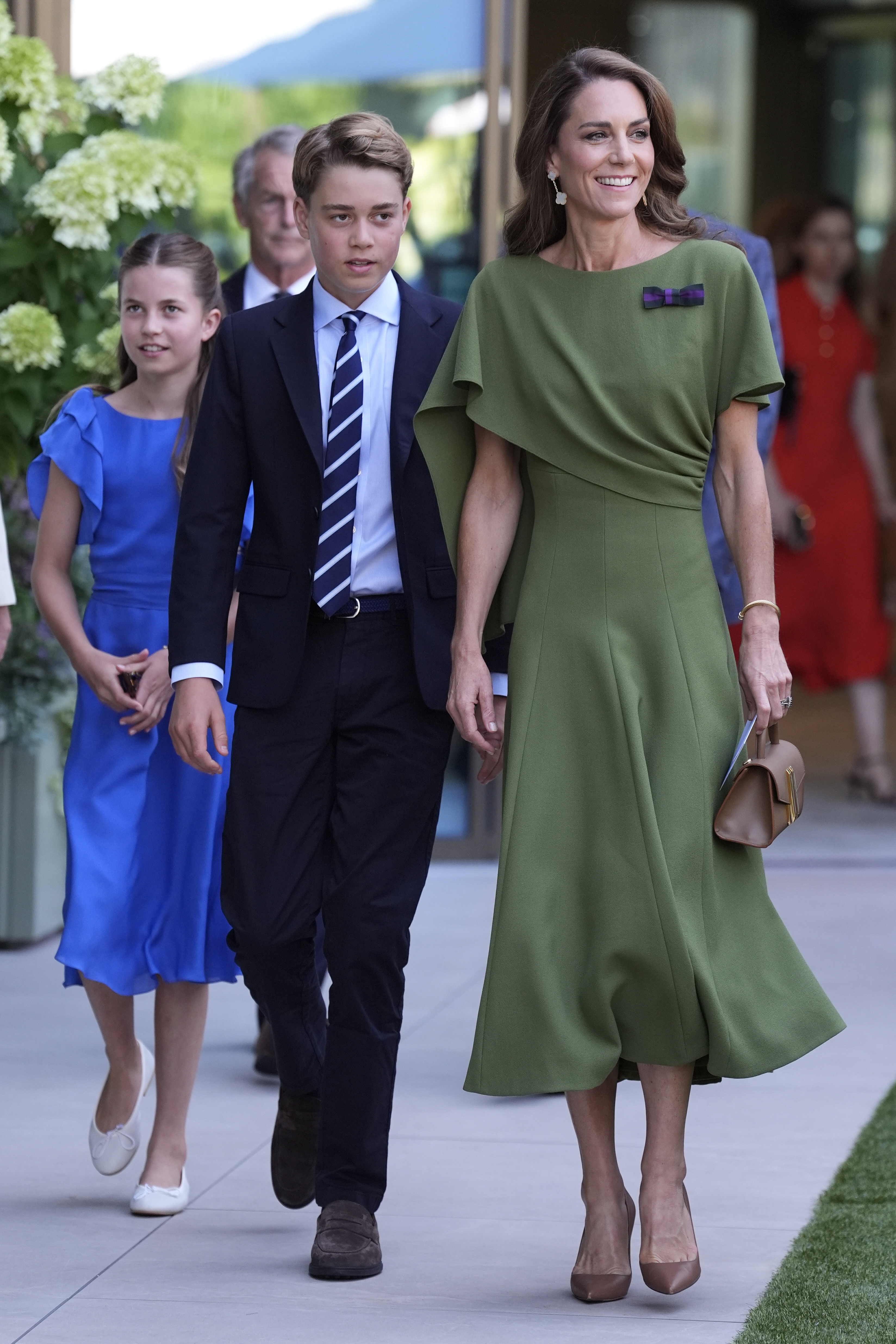 Kate, Princess of Wales, with Prince George and Princess Charlotte, arriving at Wimbledon.