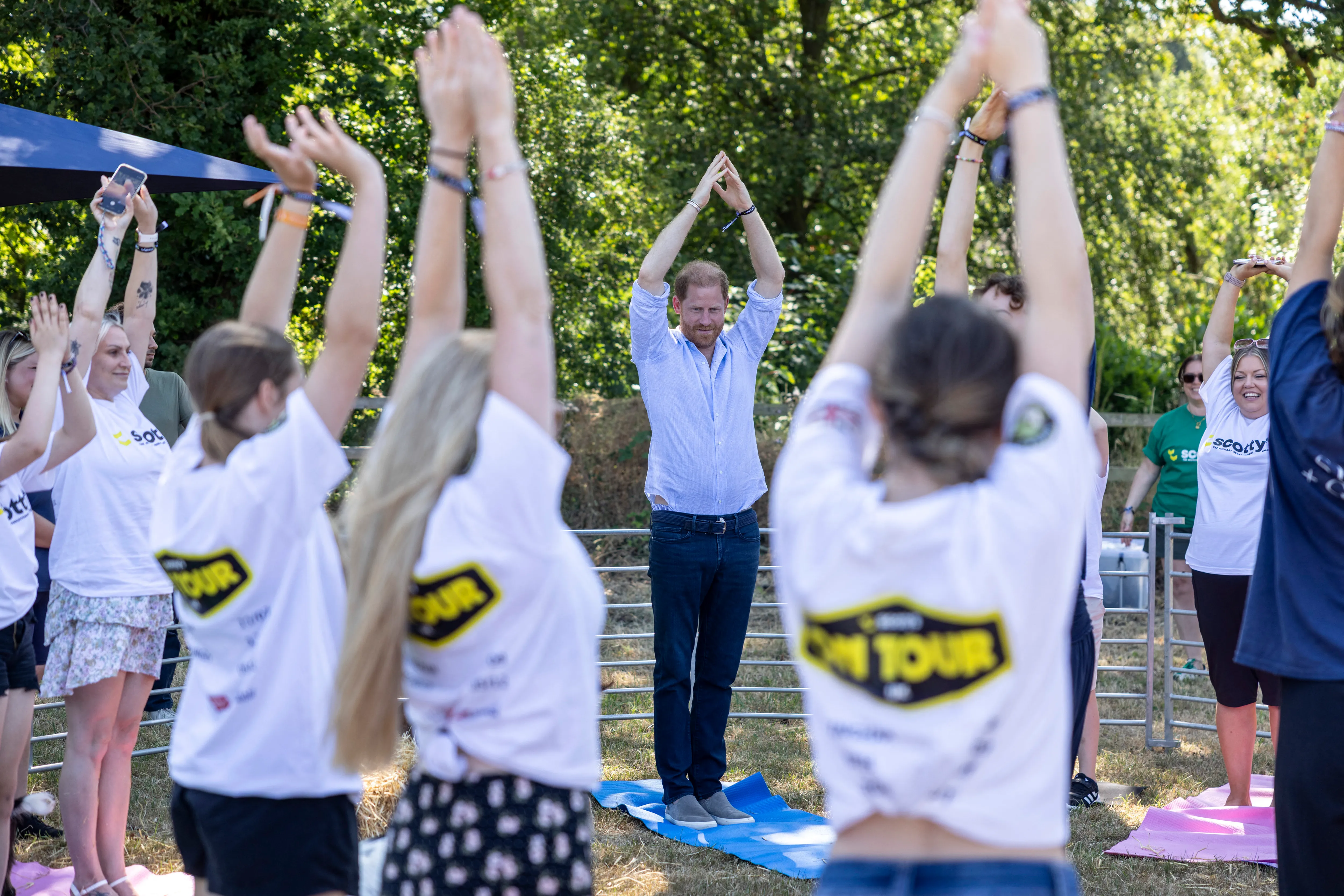 Prince Harry doing goat yoga at Scotty's Summer Festival.