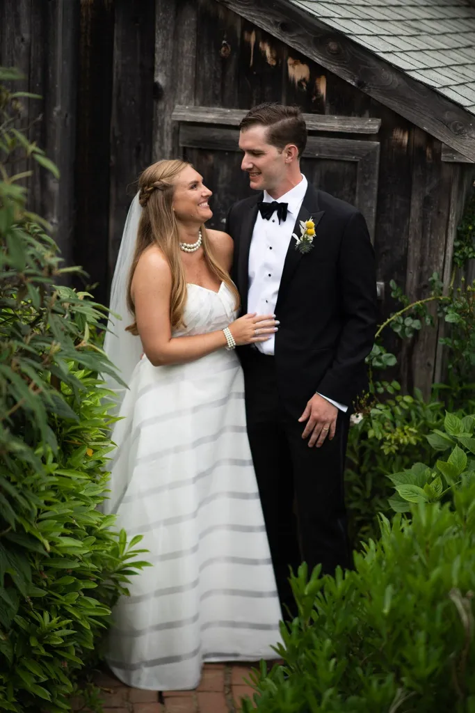 Brooke Hanlon and her husband pose for a wedding photo.