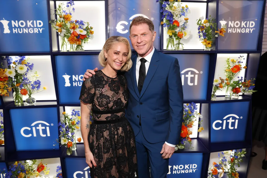 Brooke Williamson and Bobby Flay pose together at the 2025 No Kid Hungry Los Angeles Dinner.