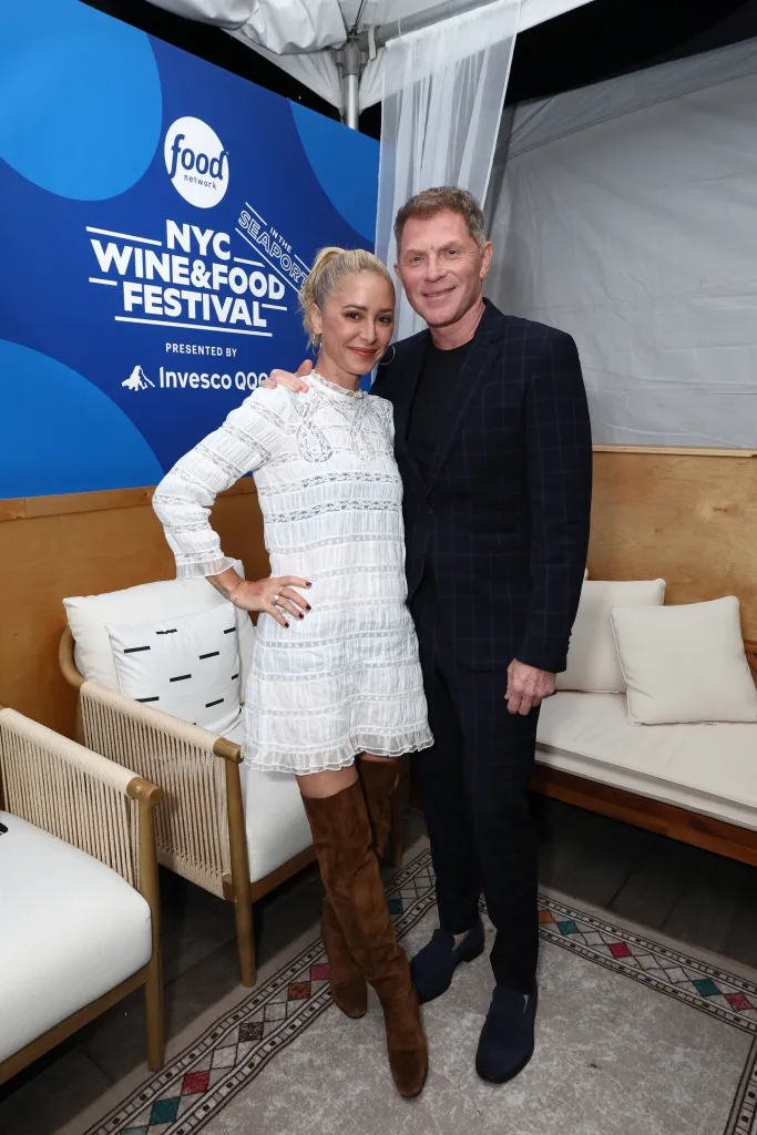 Brooke Williamson and Bobby Flay pose together at the Food Network New York City Wine & Food Festival.
