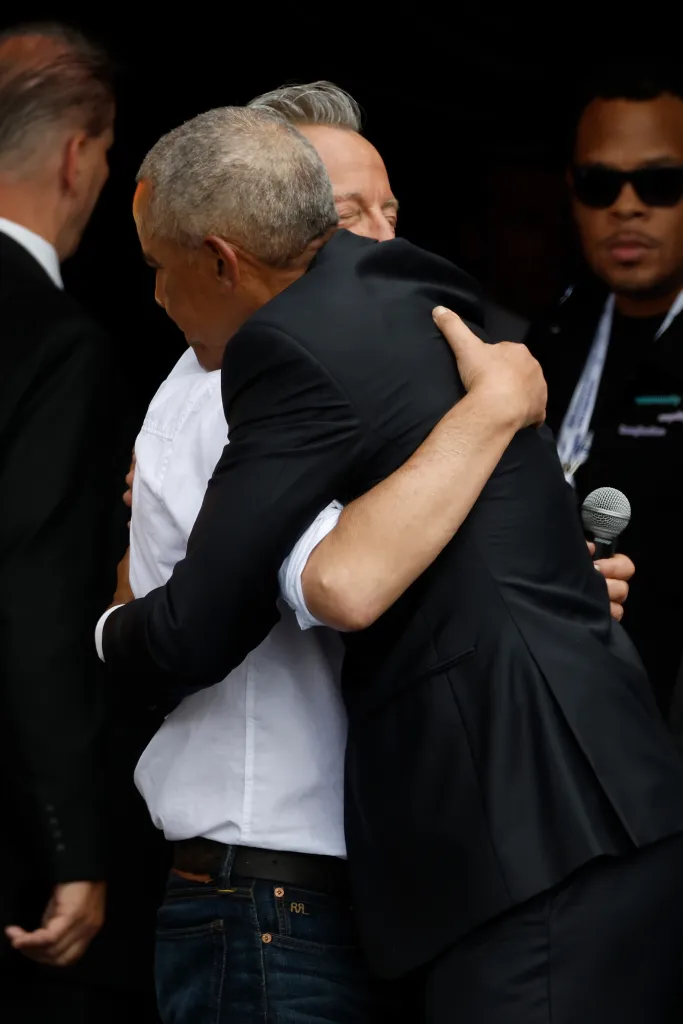 Bruce Springsteen hugging Barack Obama at the dedication ceremony for the opening of the Barack Obama Presidential Center.