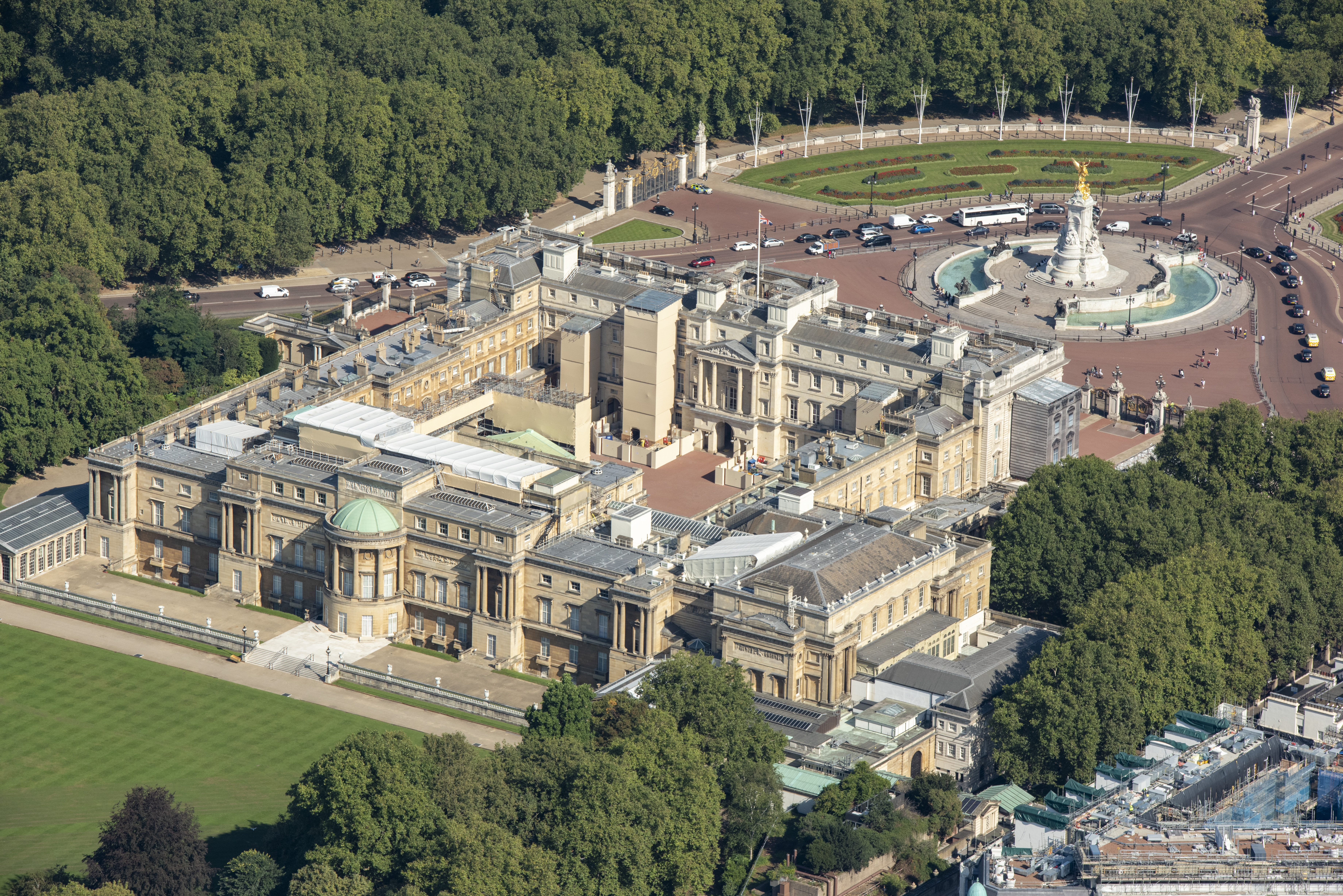Aerial view of Buckingham Palace, its gardens, and the Victoria Memorial.