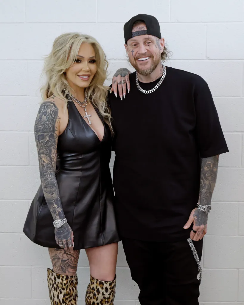 Bunnie XO and Jelly Roll posing together at the "Stripped Down: Unfiltered and Unapologetic" book tour.