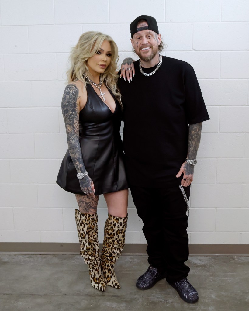 Bunnie XO and Jelly Roll posing together at a book tour event.