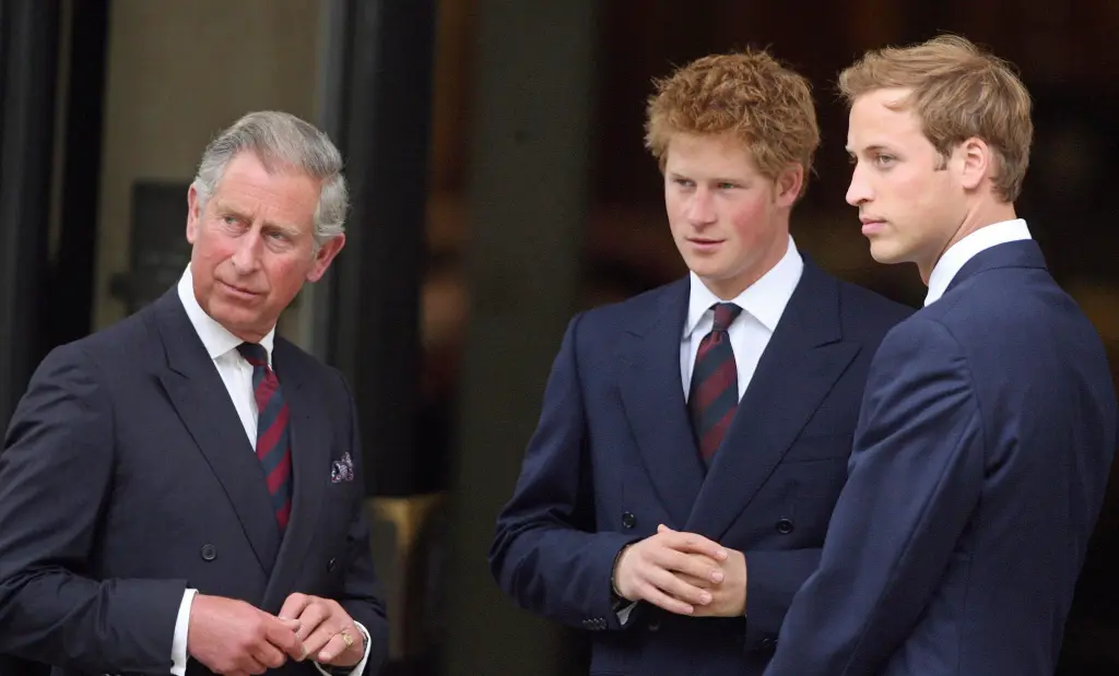 Prince Charles, Prince Harry, and Prince William in dark suits and striped ties.