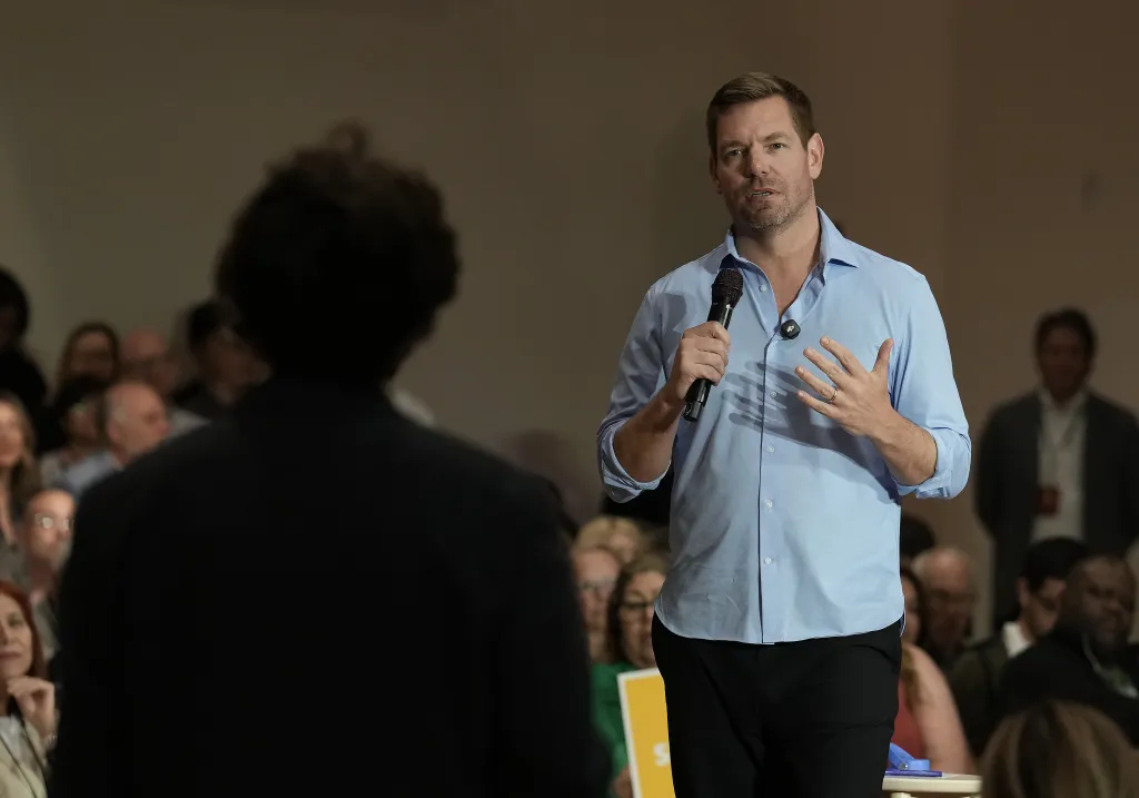 Rep. Eric Swalwell answers a question from a student during a town hall meeting.
