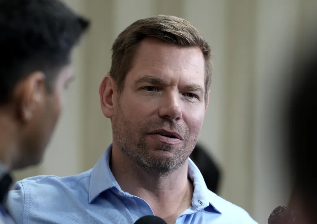 Rep. Eric Swalwell speaking to reporters at a town hall meeting.