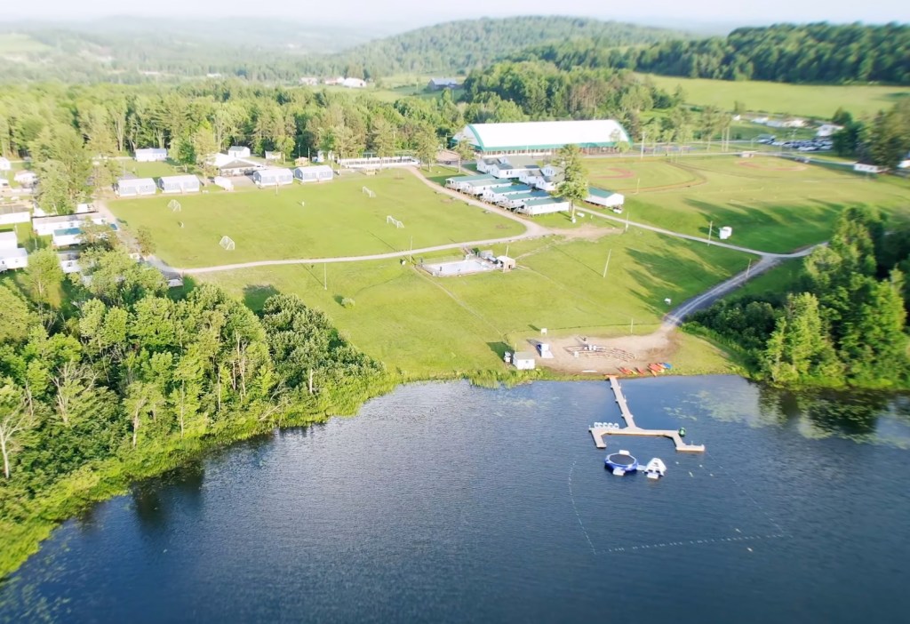 Aerial view of Camp Mesorah, showing the facilities by the lake.