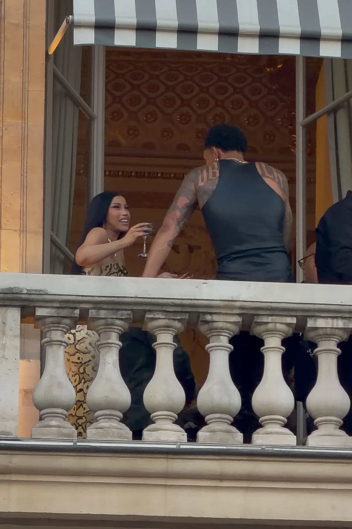 Cardi B and Maduka Okoye on a terrace in Paris.