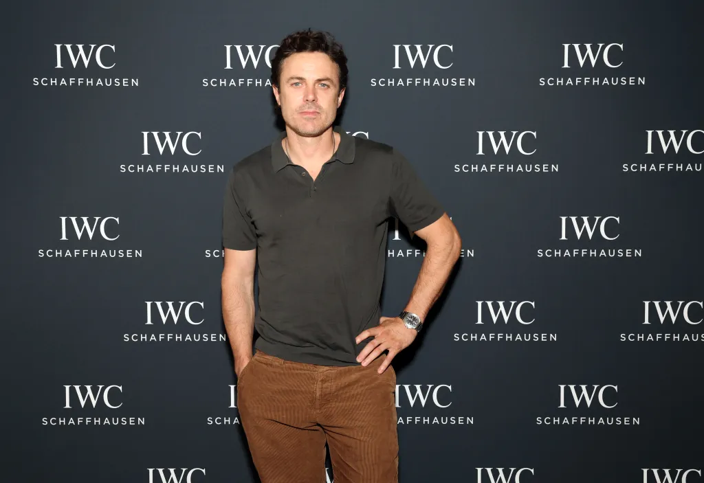 Casey Affleck posing at the IWC Schaffhausen Rodeo flagship re-opening.