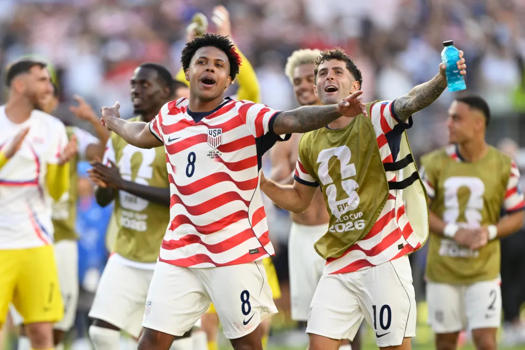 Weston McKennie and Christian Pulisic celebrating a World Cup victory.