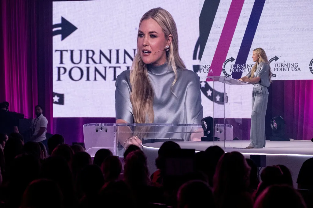 Erika Kirk, CEO of Turning Point USA, speaks at a podium during the Turning Point Women's Leadership Summit.