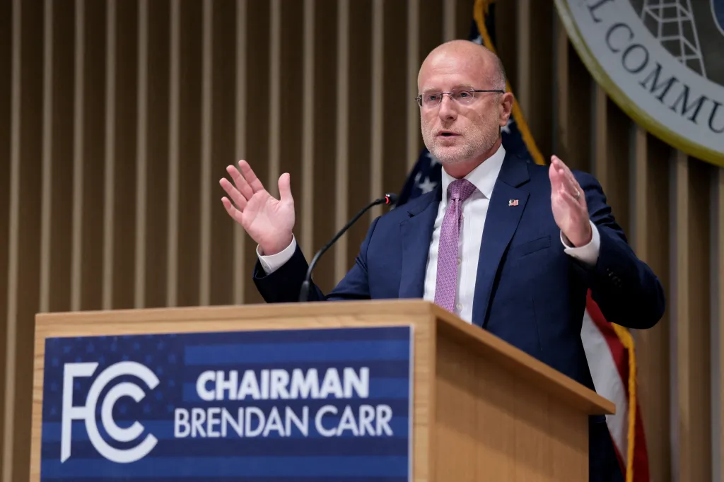FCC Chairman Brendan Carr speaks at a podium.
