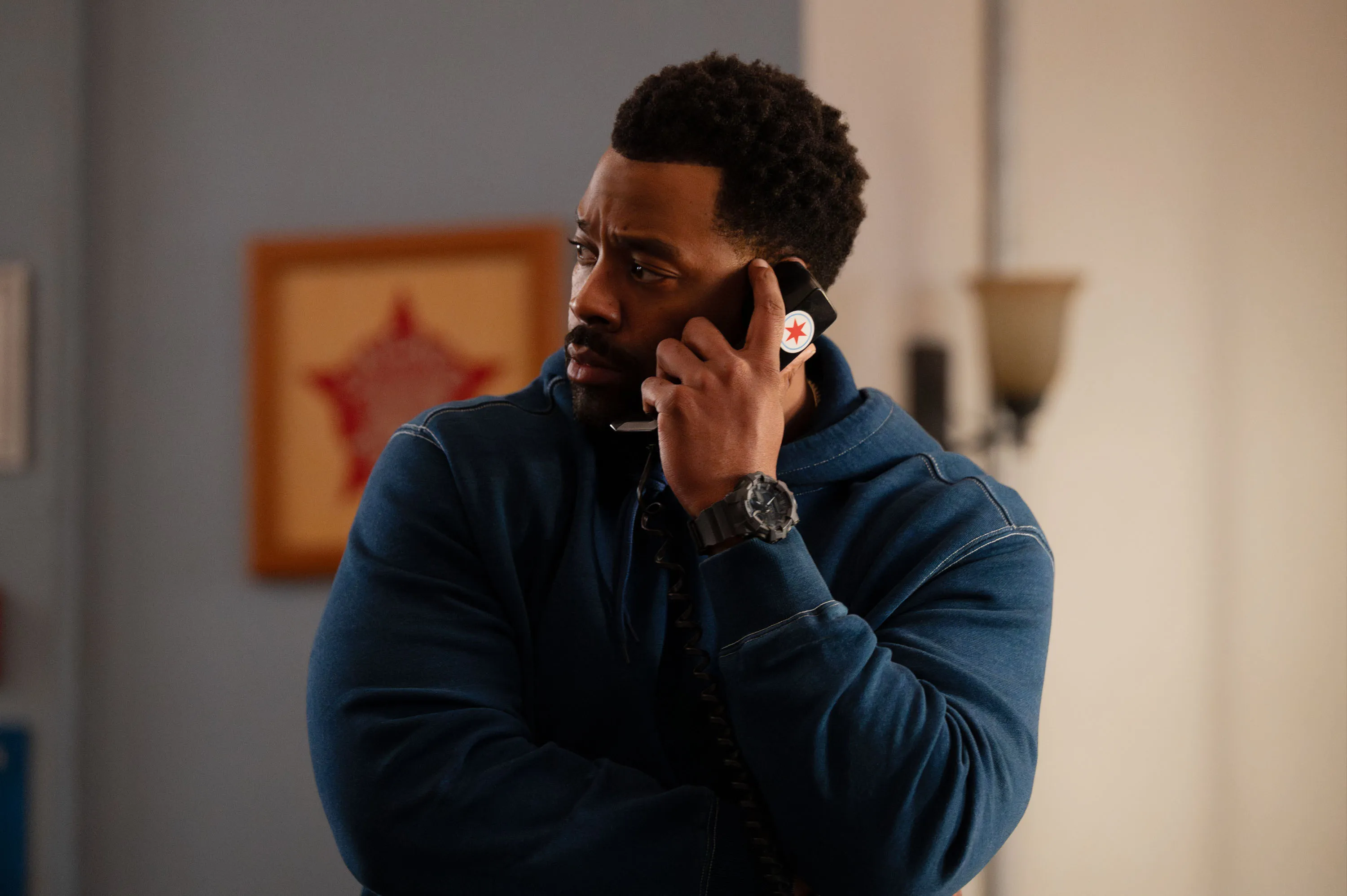 LaRoyce Hawkins as Officer Kevin Atwater on the phone.