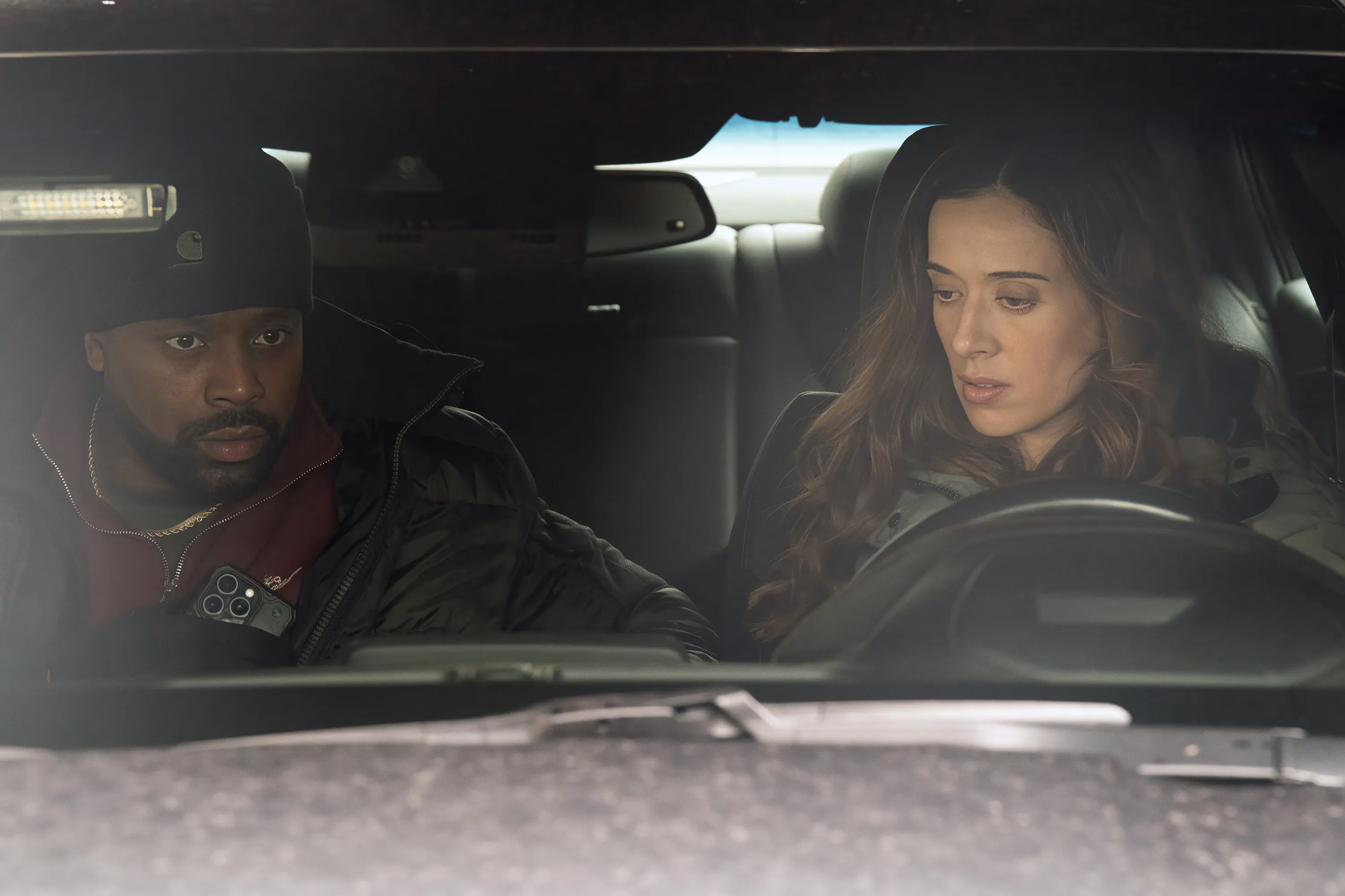 LaRoyce Hawkins as Kevin Atwater and Marina Squerciati as Officer Kim Burgess in a car.