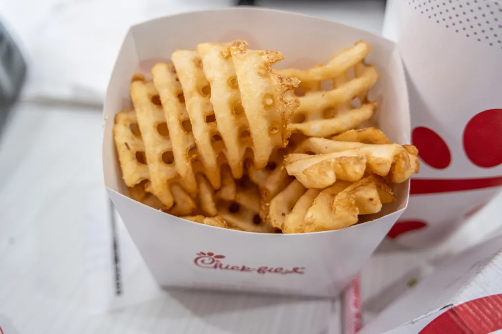 Chick-fil-A waffle fries in a carton.