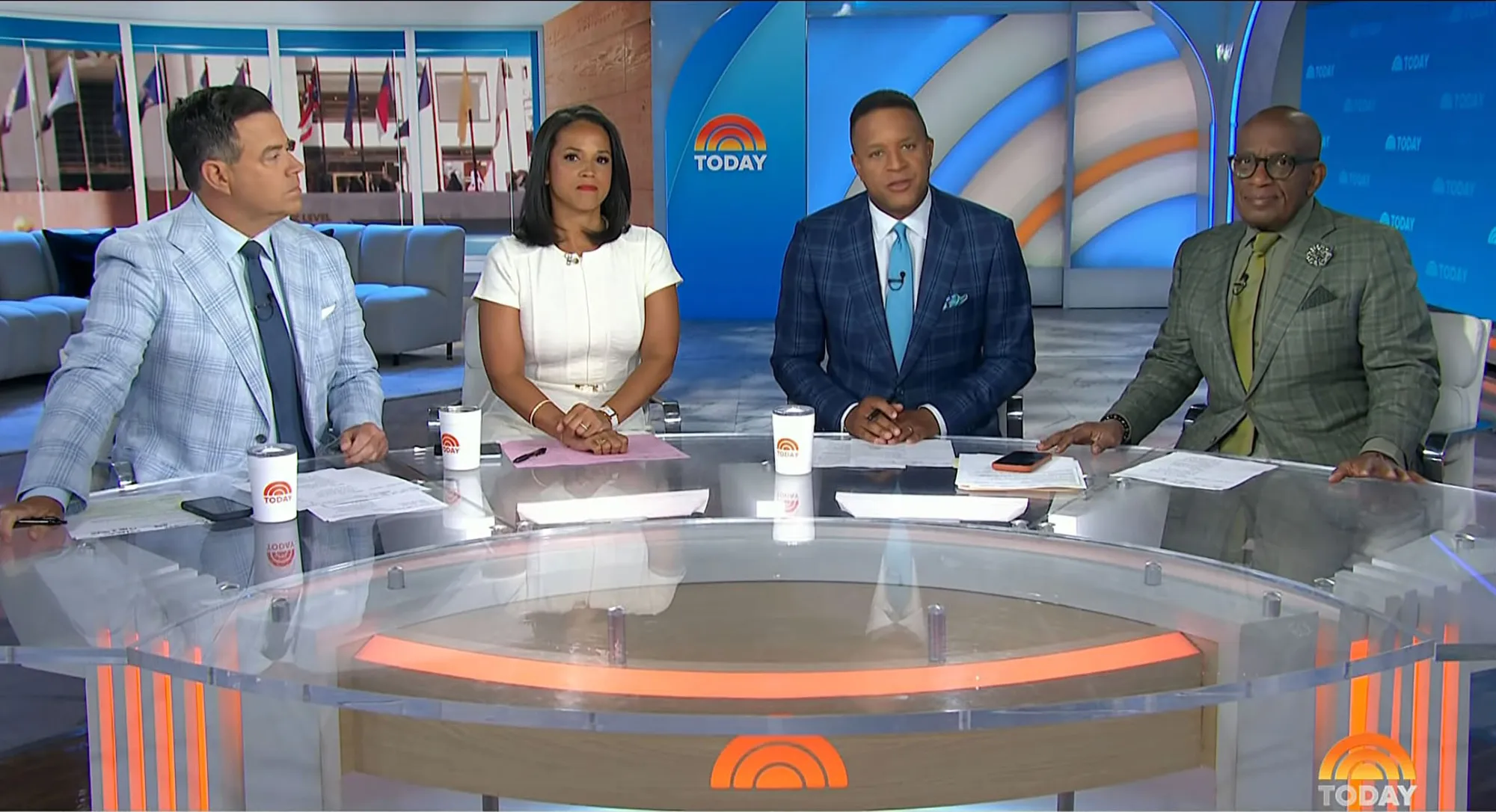 Four anchors, two men and two women, sitting at a news desk with the TODAY logo in the background.