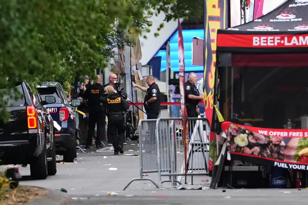 Law enforcement examines the scene of a shooting at Seattle Center.