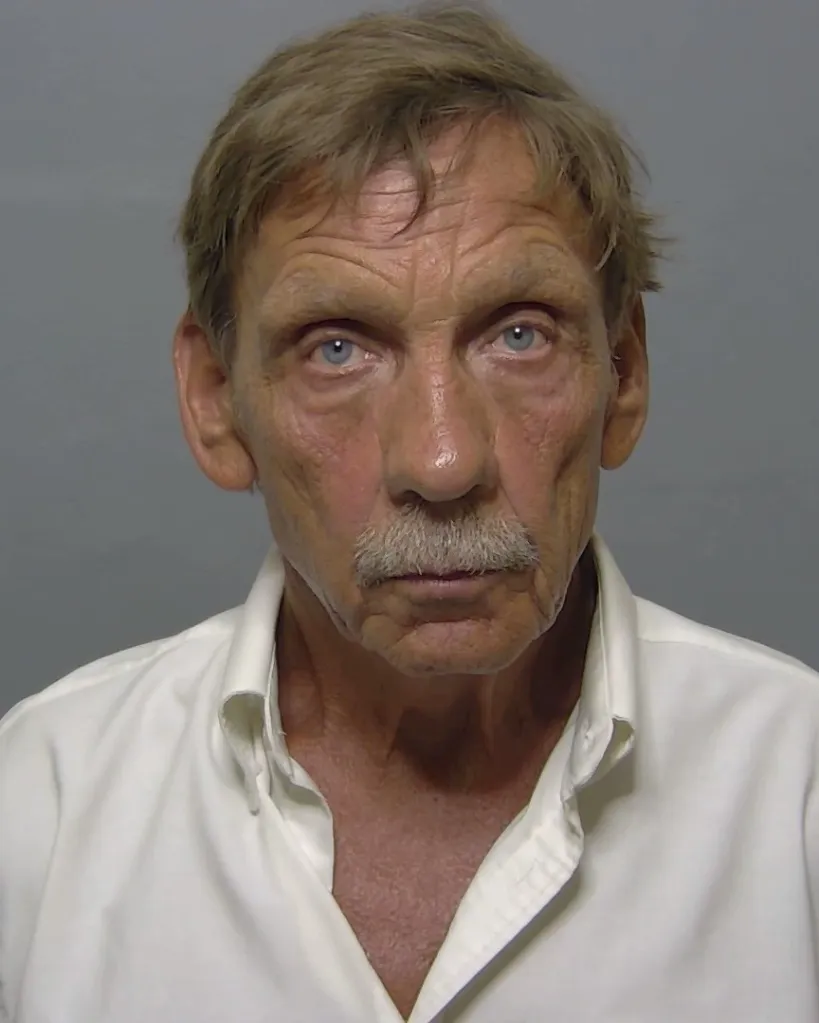 Mugshot of David O'Brien, a white man with a mustache and light blue eyes, wearing a white shirt.