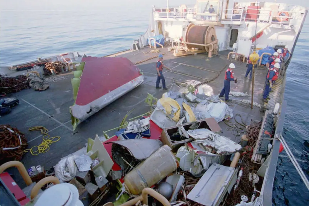 Debris from the TWA jetliner that exploded and crashed in the Atlantic Ocean is collected on the deck of US Coast Guard cutter Juniper.