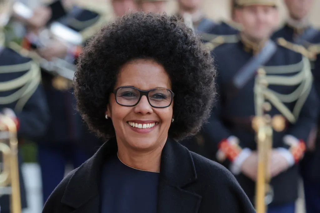 Audrey Pulvar, Deputy Mayor of Paris, smiles at a state banquet.