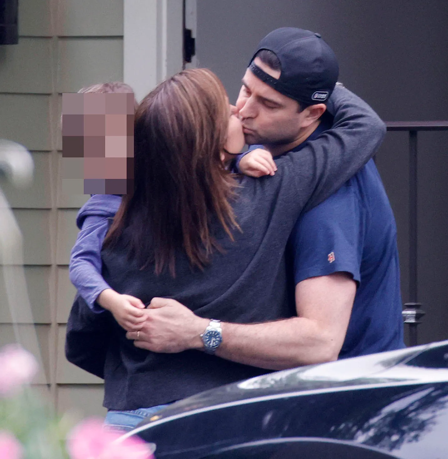 Dianna Russini greeting her husband Kevin Goldschmidt and their child.