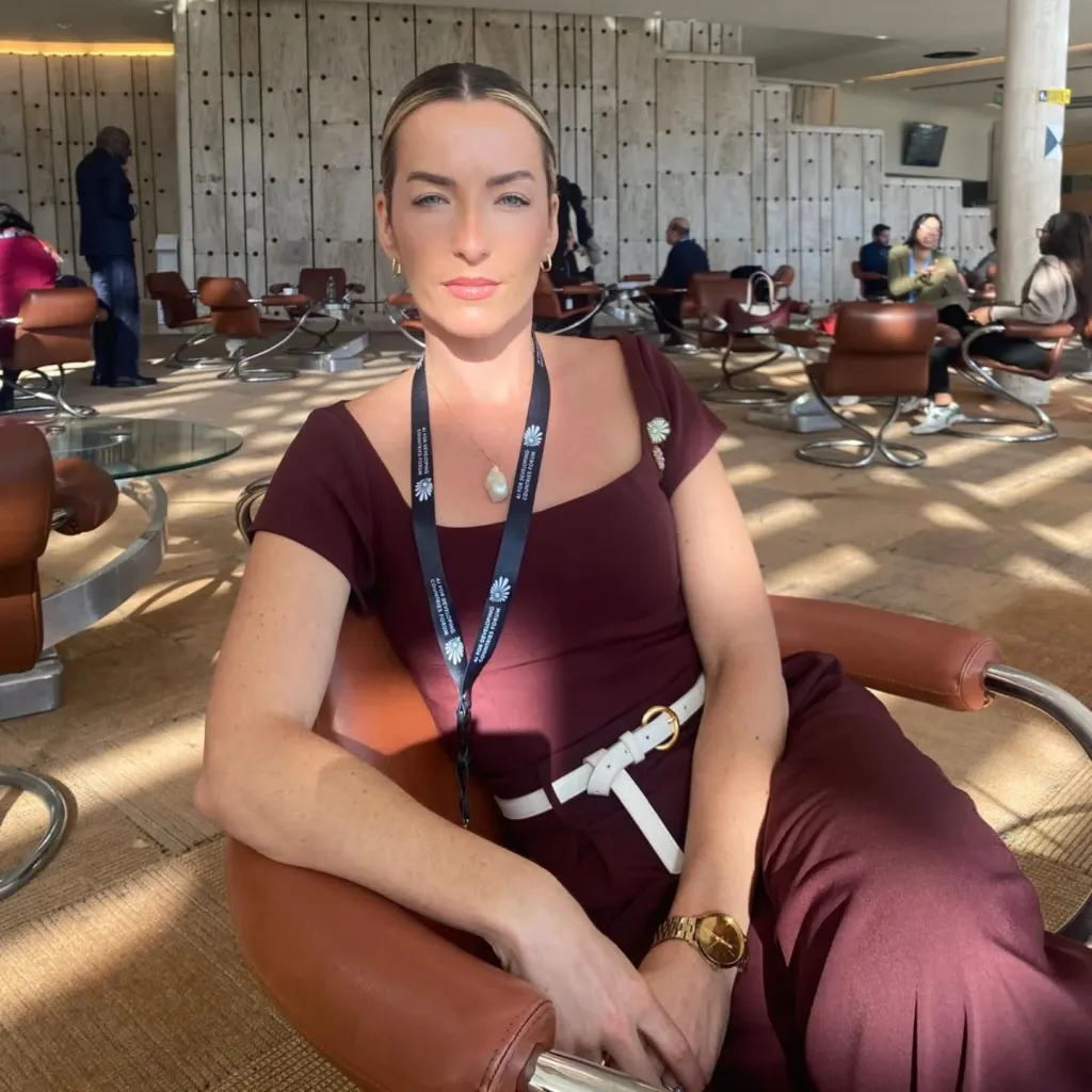 Nici Sweaney, CEO of AI Her Way, sitting in a lounge area.