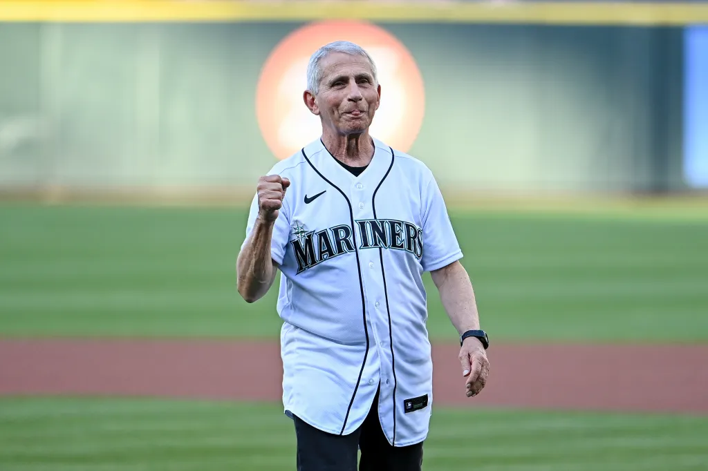 Dr. Anthony Fauci throwing out the ceremonial first pitch at a baseball game.