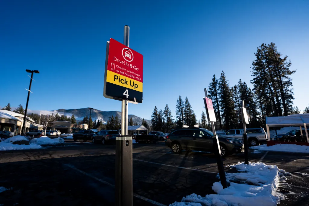 A Safeway grocery store parking spot for DriveUp & Go pickup, with some snow.