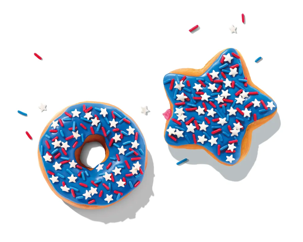 Dunkin's red, white, and blue donuts, with a round one and a star-shaped one, featuring blue frosting and star and sprinkle toppings.