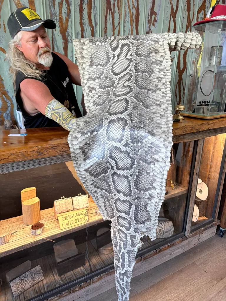 Crum with a giant snake skin.
