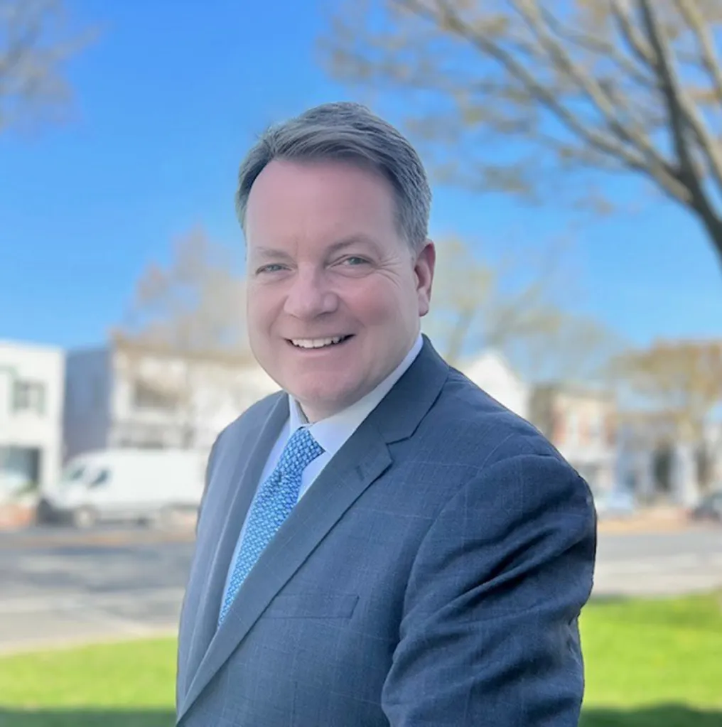 East Hampton Village Mayor Jerry Larsen smiling outside.