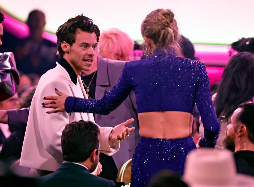 Harry Styles and Taylor Swift speaking at the 65th GRAMMY Awards.