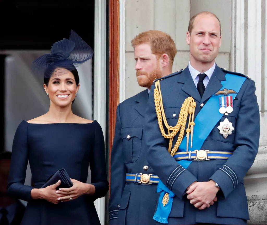 Meghan, Duchess of Sussex, Prince Harry, and Prince William watch a flypast from the balcony of Buckingham Palace.