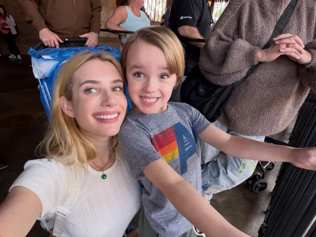 Emma Roberts smiling with her son.