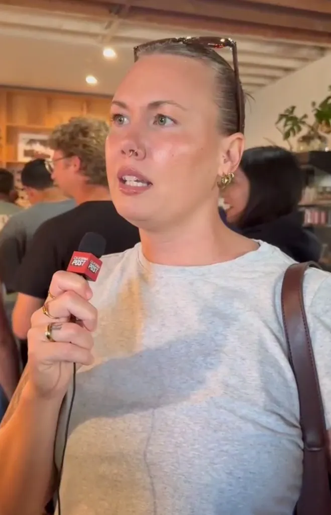 Emma Rudder speaking into a "California Post" microphone.