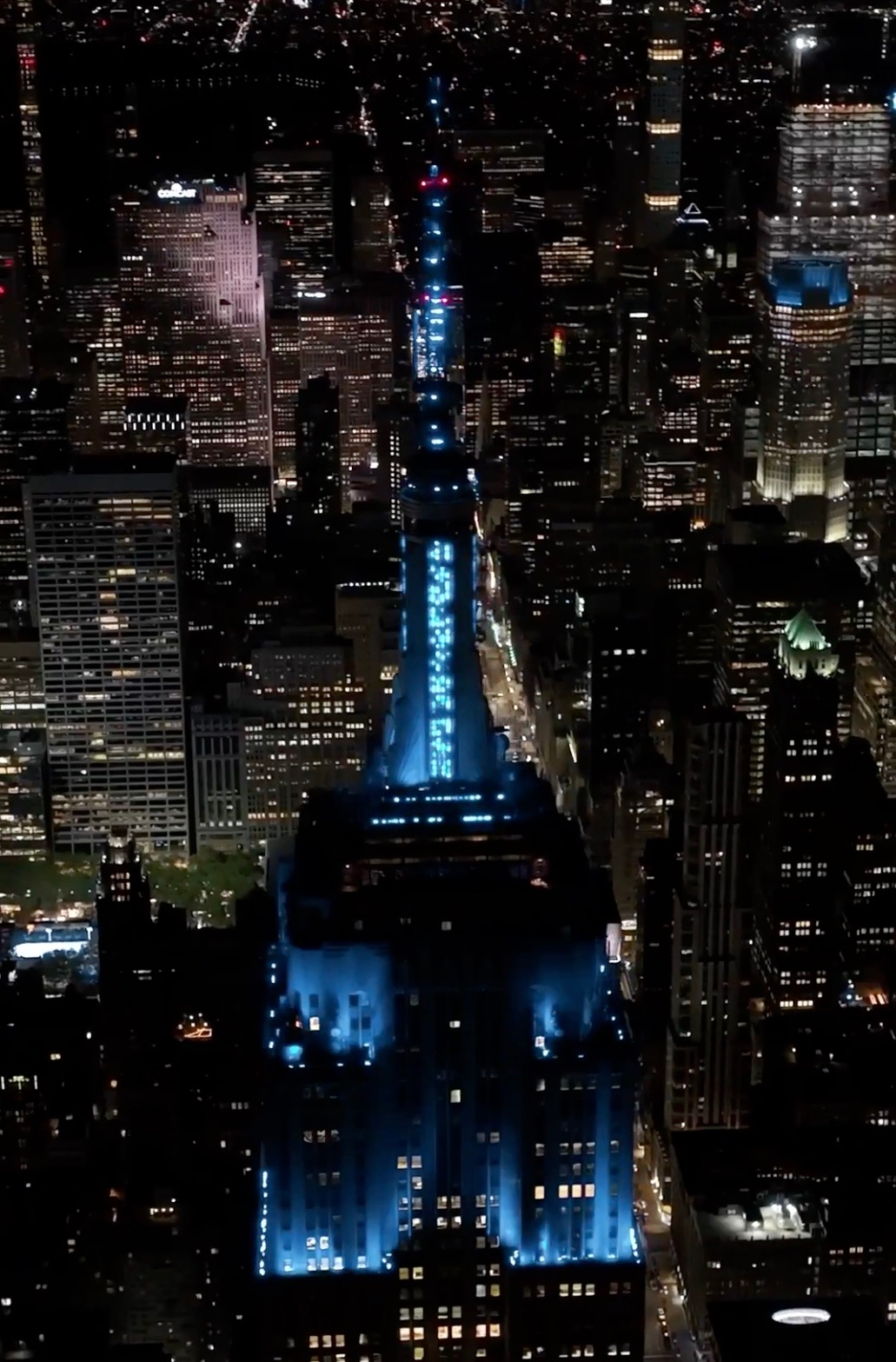 The Empire State Building lit up in blue and red lights for Taylor Swift and Travis Kelce.