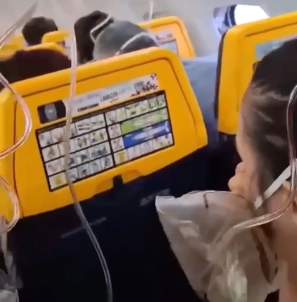 Passenger wearing an oxygen mask on a Ryanair flight.
