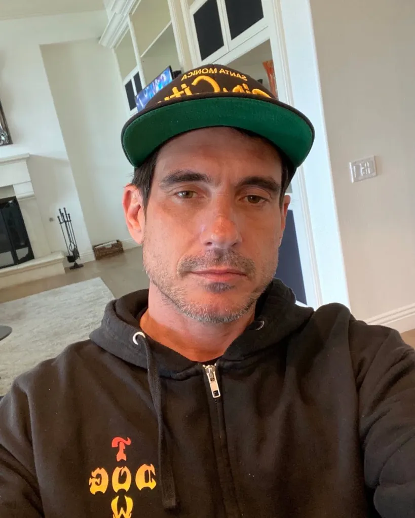 Ethan Browne wearing a black hoodie and a baseball cap with "Santa Monica" written on it.