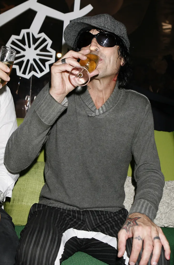 Tommy Lee of Mötley Crüe drinking champagne.