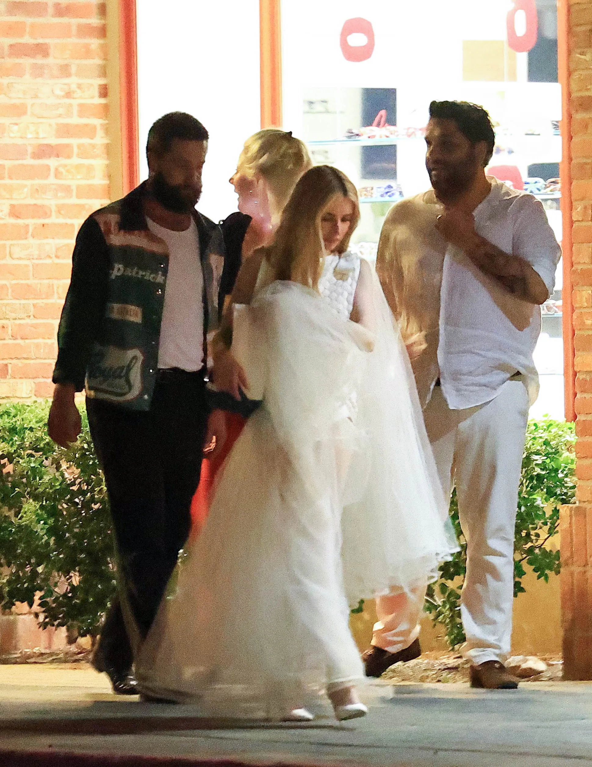 Emma Roberts and Cody John are spotted bar hopping with family and friends after attending their wedding rehearsal dinner in Ketchum, Idaho.