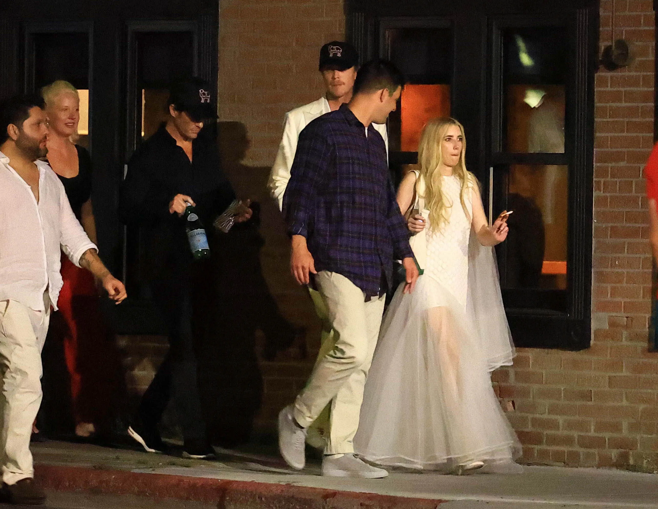 Emma Roberts and Cody John bar hopping with family and friends after their wedding rehearsal dinner.