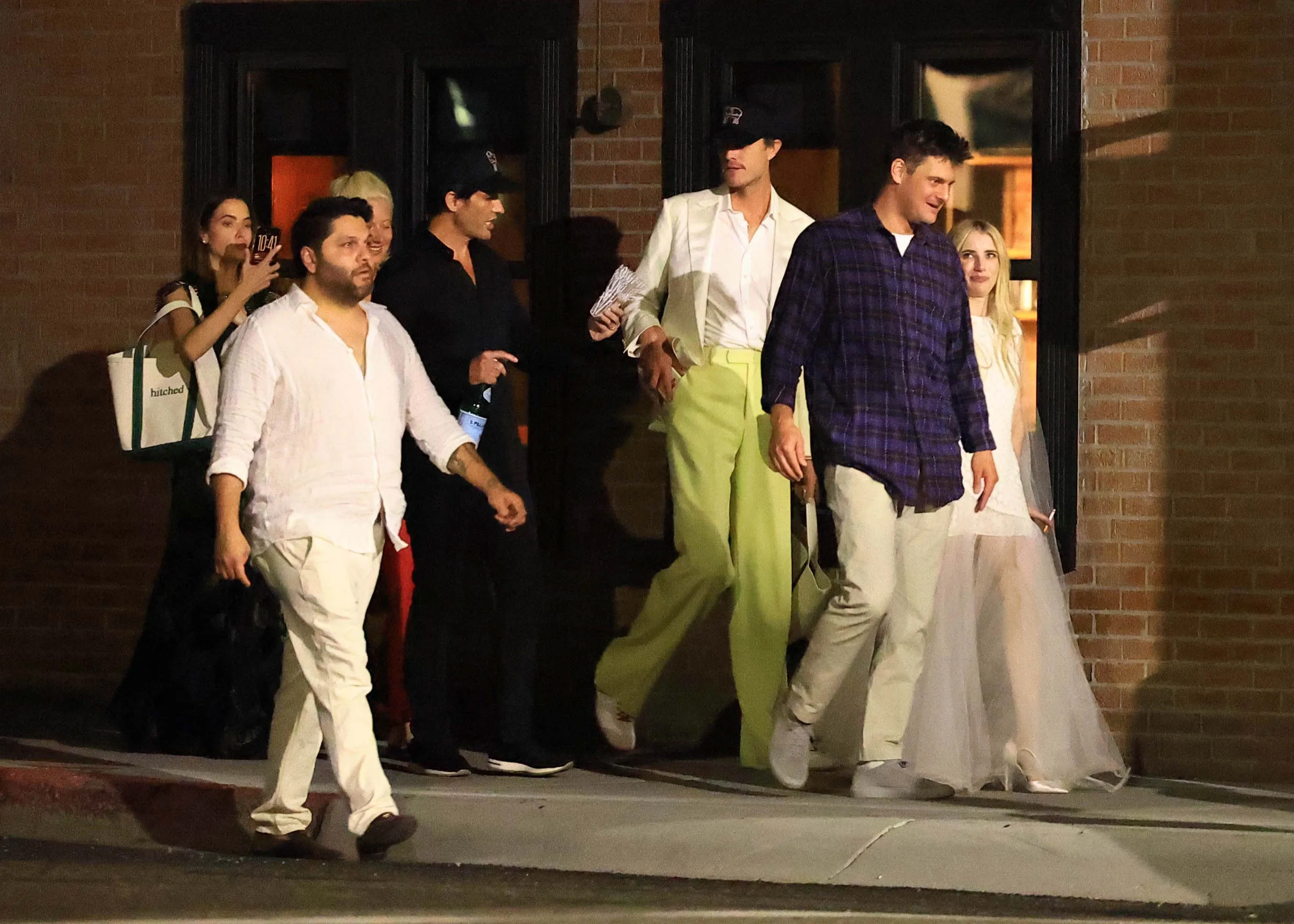 Emma Roberts and Cody John are spotted bar hopping with family and friends after attending their wedding rehearsal dinner in Ketchum, Idaho.