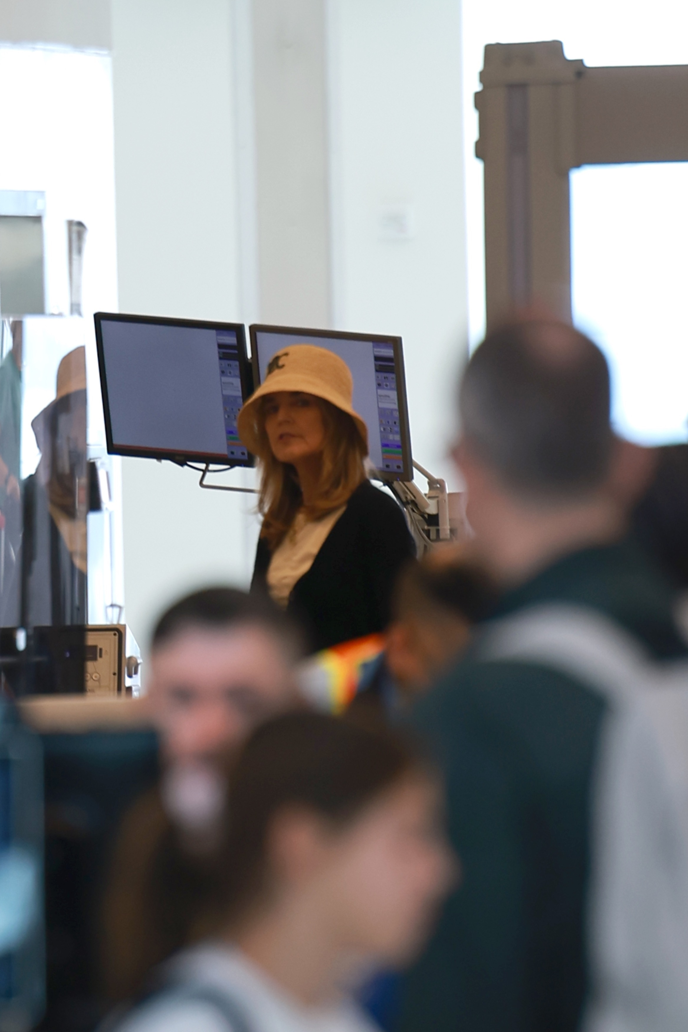 Savannah Guthrie wearing a bucket hat at LaGuardia Airport.