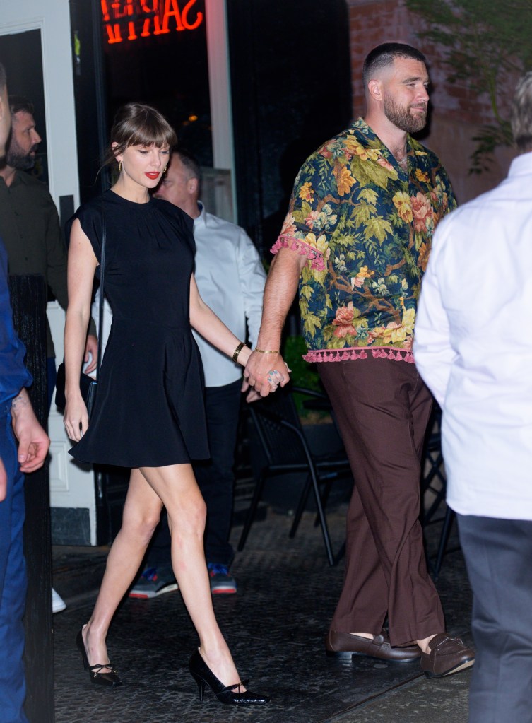 Taylor Swift and Travis Kelce leaving Sartiano's restaurant hand-in-hand.