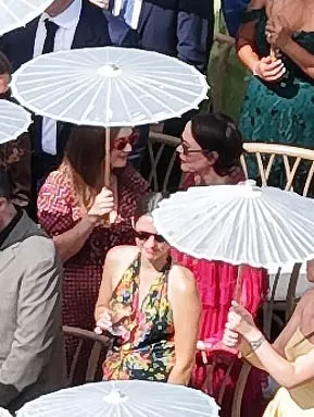 Billie Lourd and Sarah Paulson attending Emma Roberts' wedding.